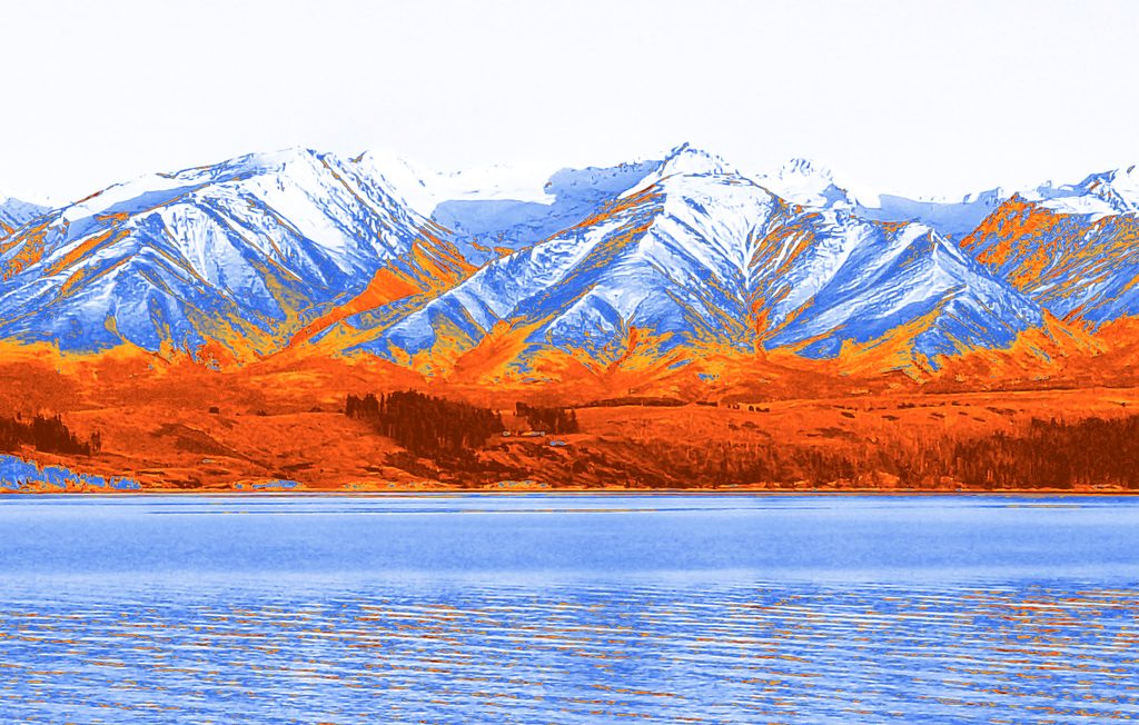 A mountain range above a lake, mapped to blue and orange